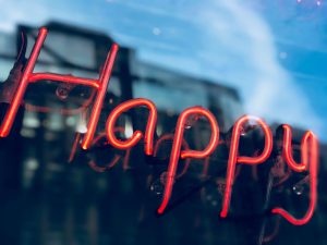 Neon sign 'Happy' for enjoying retirement at 55