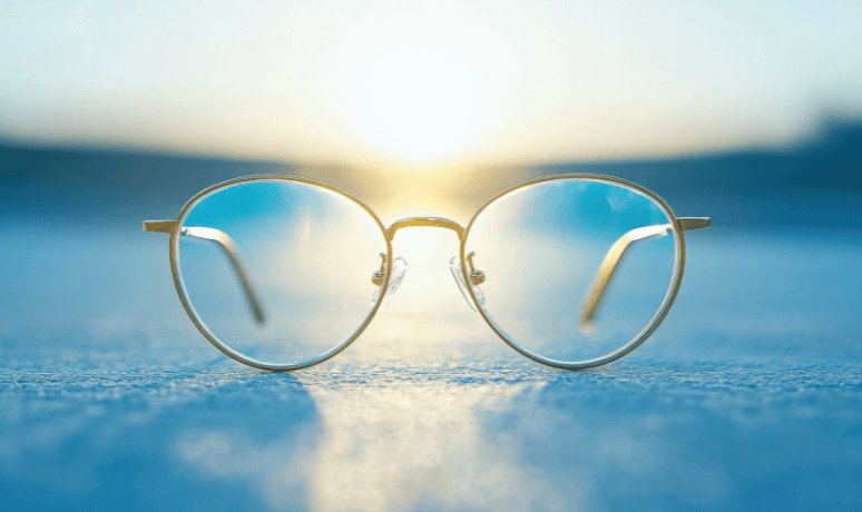 gold glasses with blue skies to reframe your future