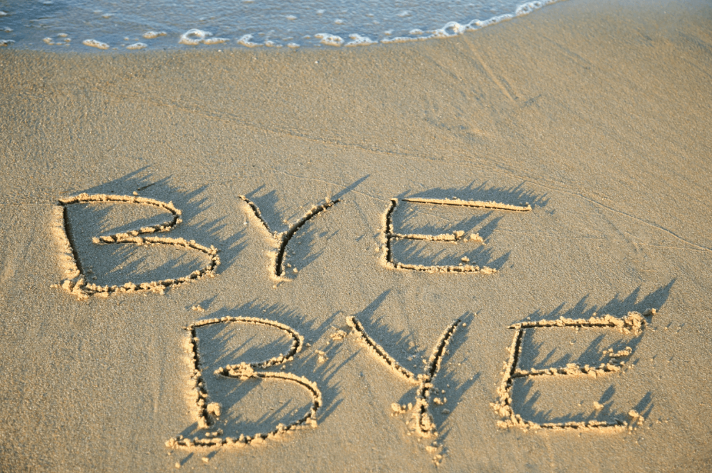 writing in sand to say bye bye